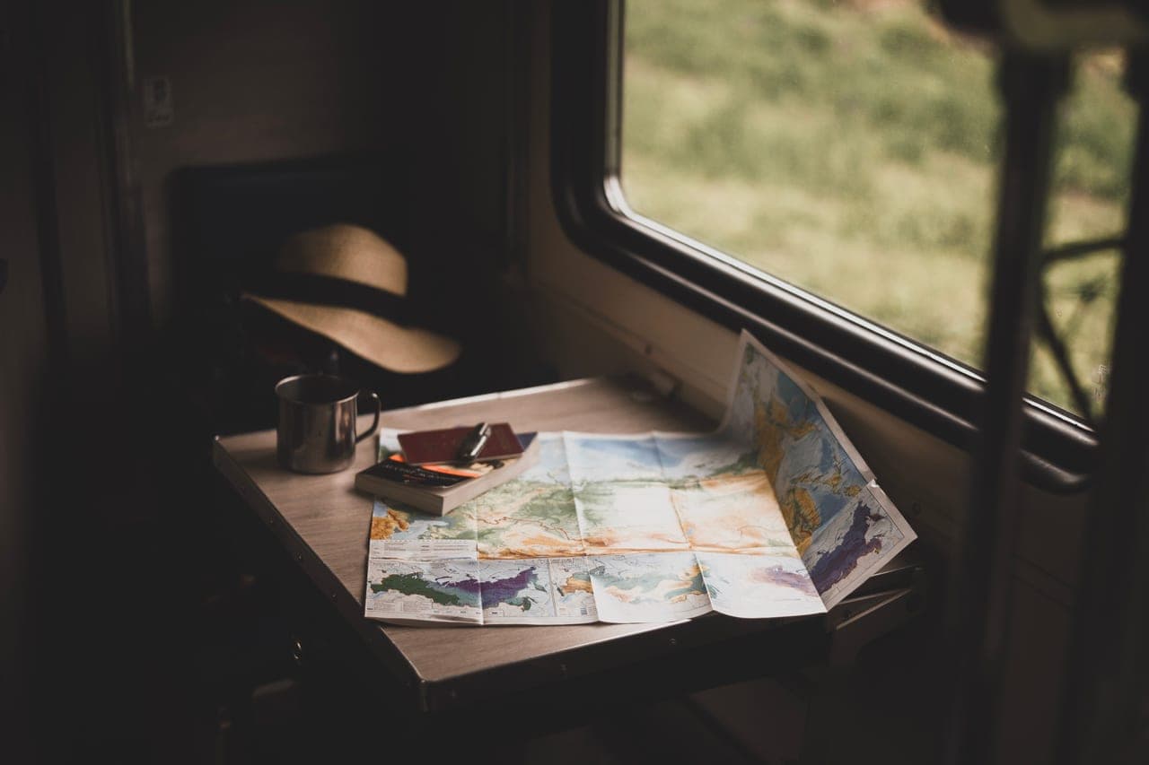 A vintage railway map spread out on a table