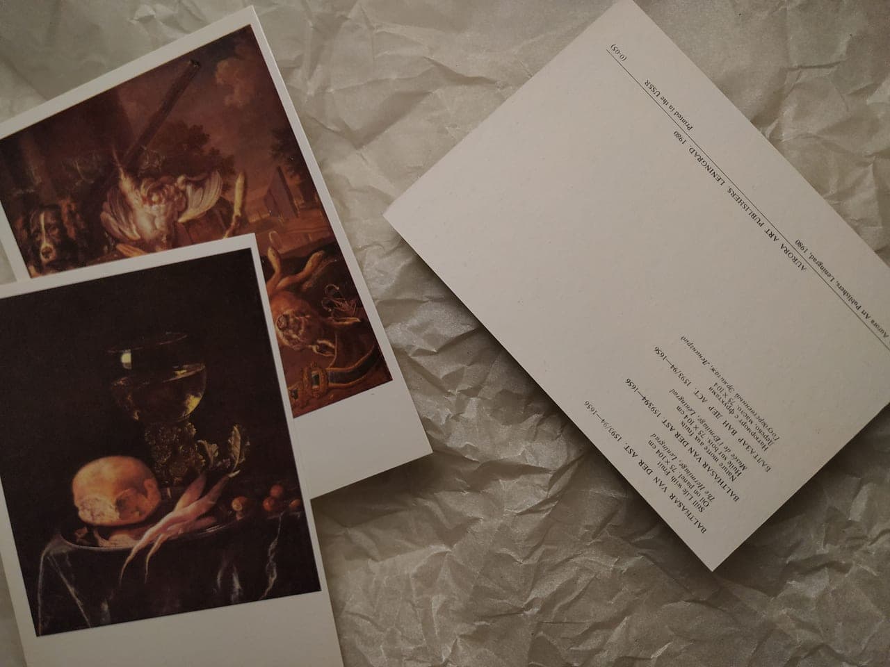 Illustrated bird cards arranged as a still life