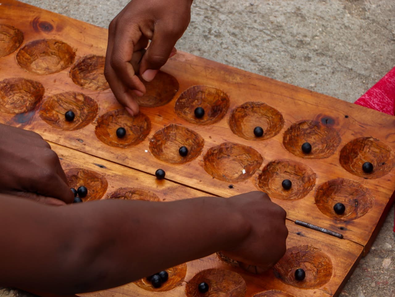 Several hands cooperating over a shared game board
