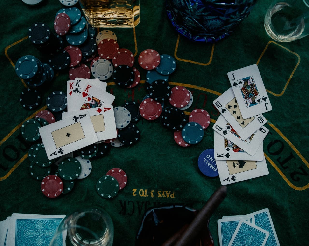 Chips and cards laid out on a table, seen from overhead