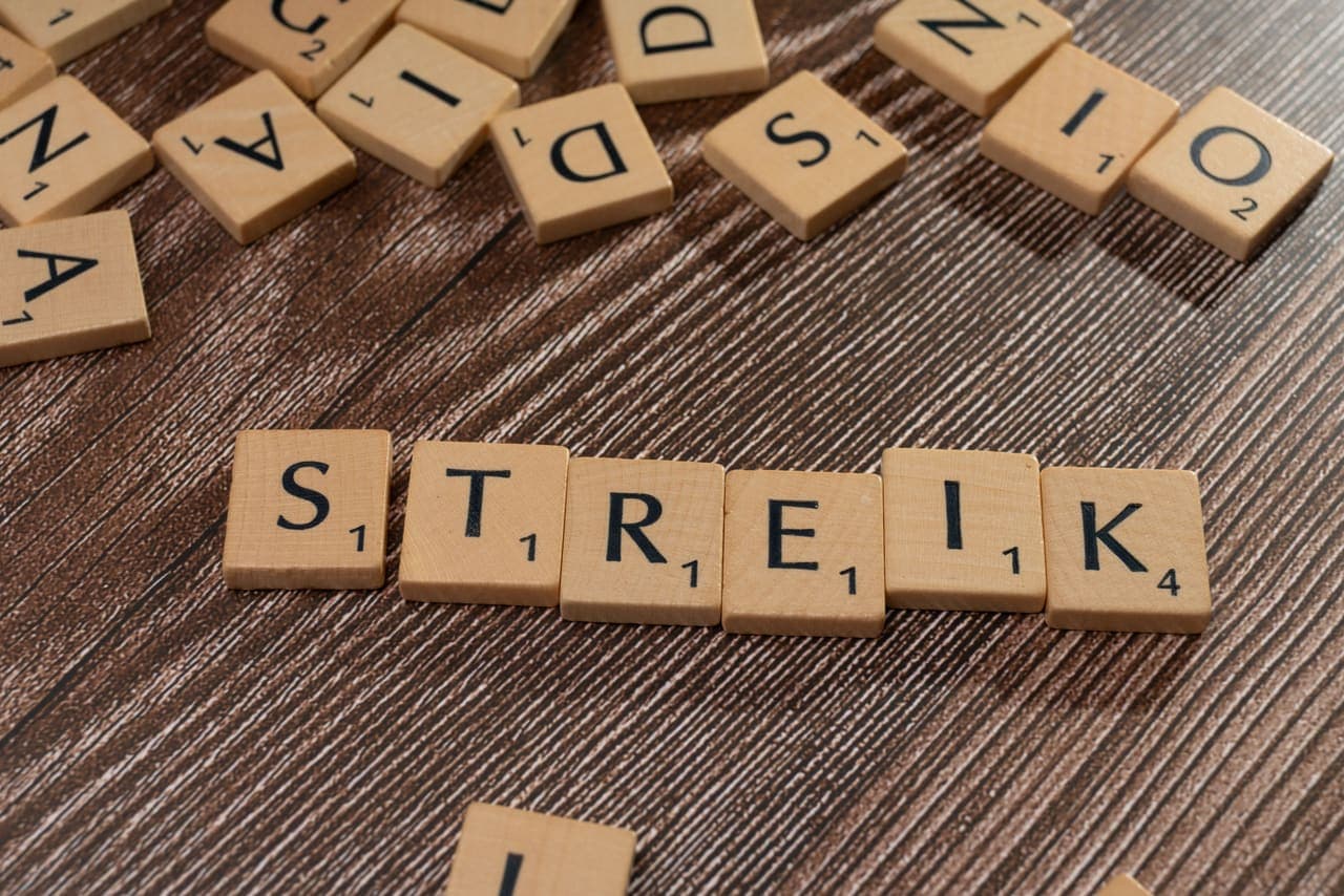 Wooden letter tiles arranged into words on a table